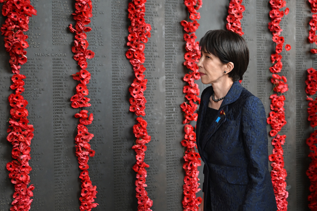 Japan's Prime Minister Sanae Takaichi walks along the Roll of Honour during a visit to the Australian War Memorial in Canberra, Australia, Monday, May 4, 2026. (Lukas Coch/AAP Image via AP)