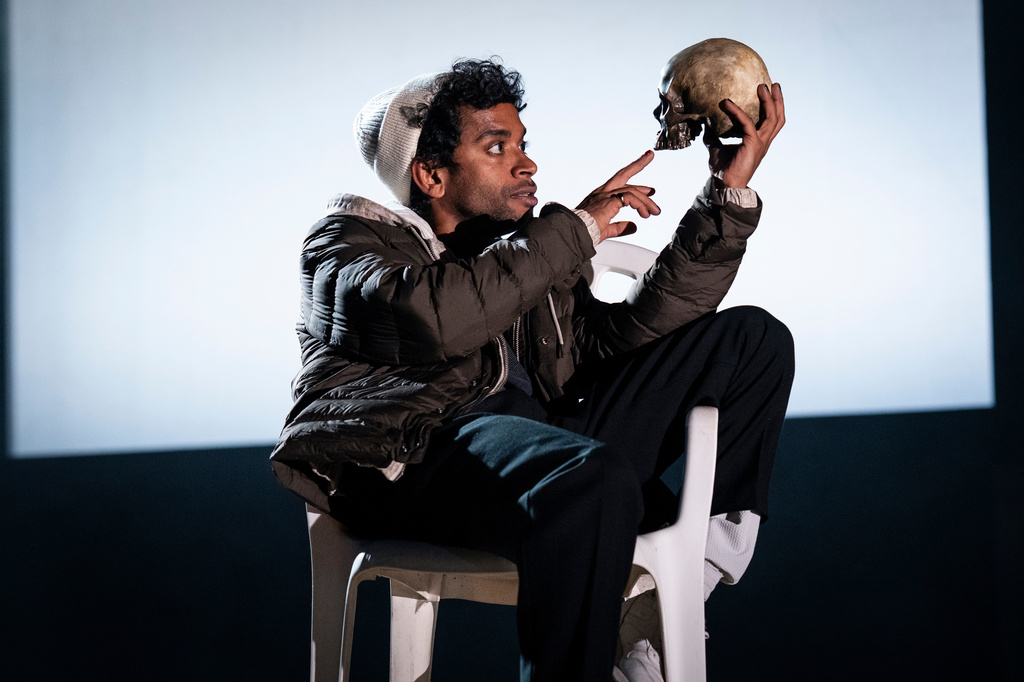 This image released by Polk & Co. shows Hiran Abeysekera in the role of Hamlet at the National Theatre in London on Sept. 25, 2025. (Sam Taylor/Polk & Co. via AP)