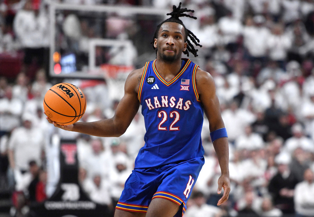Kansas guard Darryn Peterson looks to pass the ball during the second half of an NCAA college basketball game against Texas Tech, Monday, Feb. 2, 2026, in Lubbock, Texas. (AP Photo/Annie Rice)
