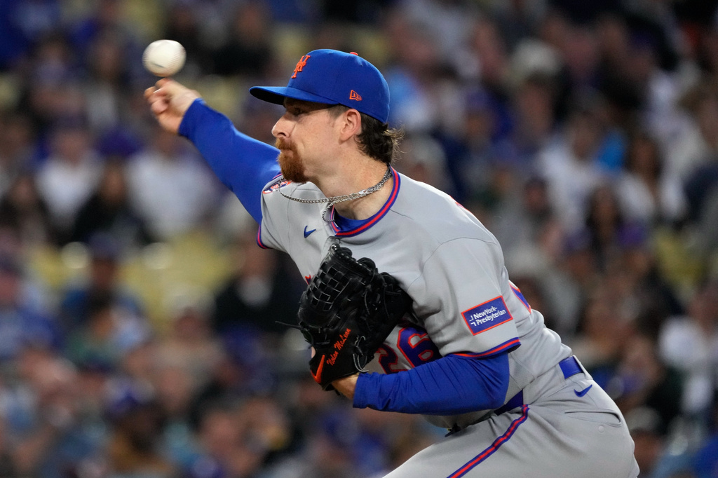 New York Mets starting pitcher Nolan McLean throws to the plate during the first inning of a baseball game against the Los Angeles Dodgers, Tuesday, April 14, 2026, in Los Angeles. (AP Photo/Mark J. Terrill)