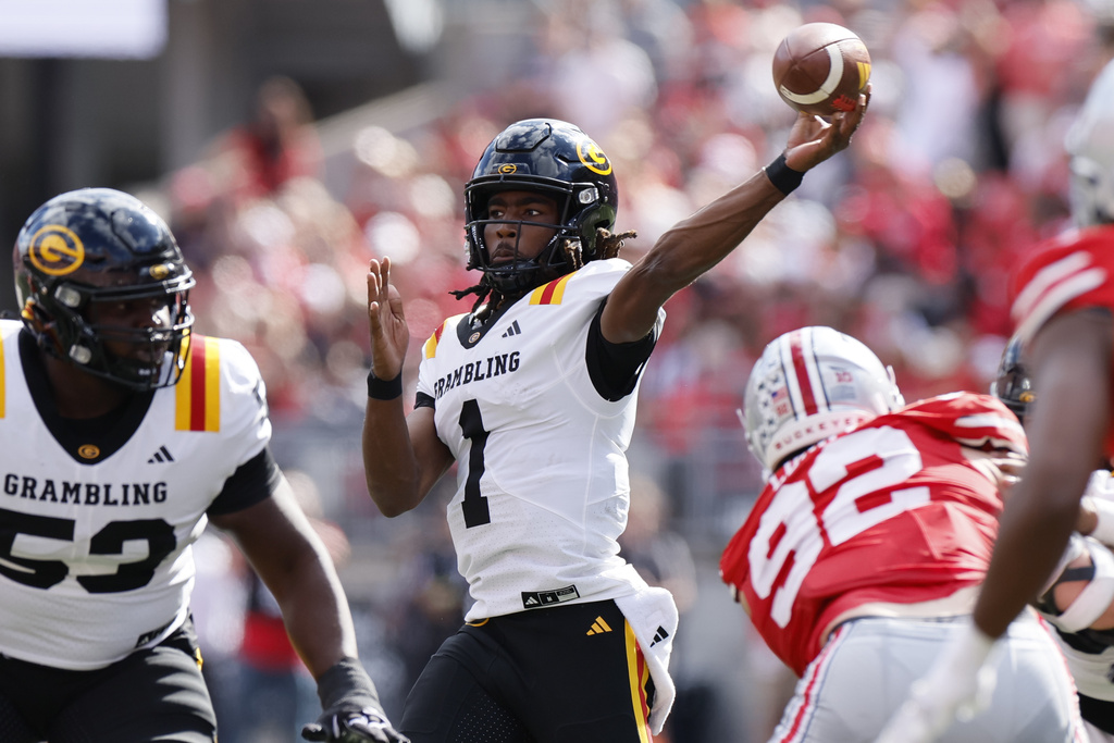 Grambling State quarterback C'zavian Teasett (1) looks to throw a pass against Ohio State during the first half of an NCAA college football game, Saturday, Sept. 6, 2025, in Columbus, Ohio. (AP Photo/Jay LaPrete)
