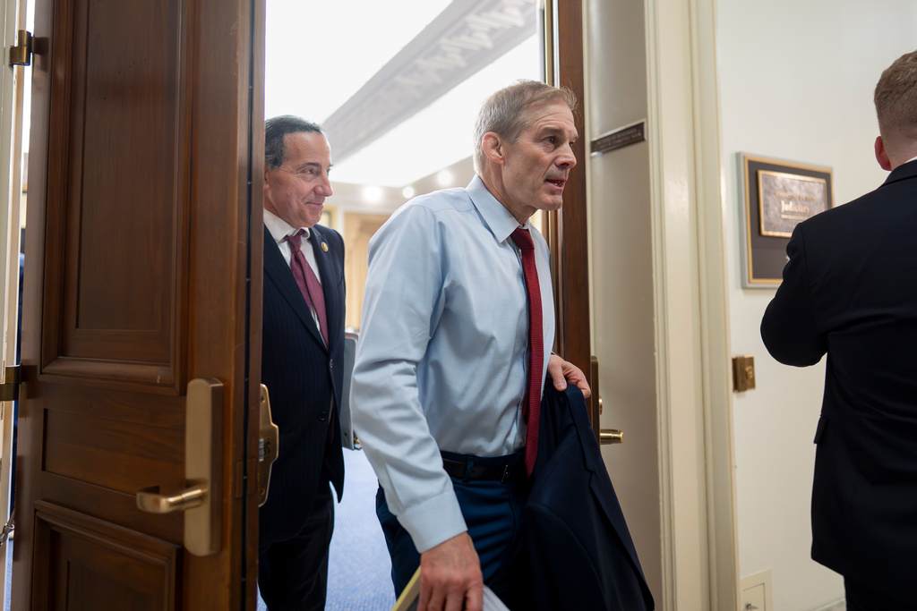 Rep. Jim Jordan, R-Ohio, chairman of the House Judiciary Committee, center, followed by Rep. Jamie Raskin, D-Md., the ranking member, left, depart at the end of a closed-door deposition from former Department of Justice Special Counsel Jack Smith about his investigations into President Donald Trump, on Capitol Hill in Washington, Wednesday, Dec. 17, 2025. (AP Photo/J. Scott Applewhite)