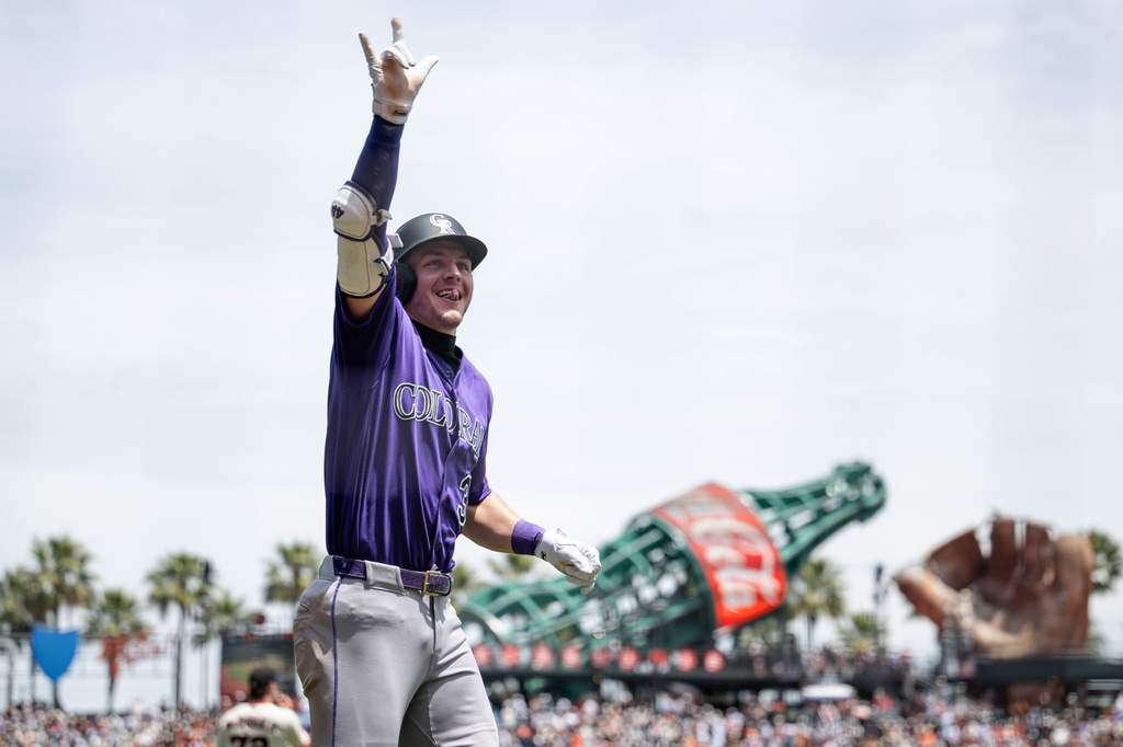 Colorado Rockies' Jake McCarthy reacts after scoring during the first inning of a baseball game against the San Francisco Giants, Sunday, July 12, 2026, in San Francisco. (AP Photo/Thien-An Truong)