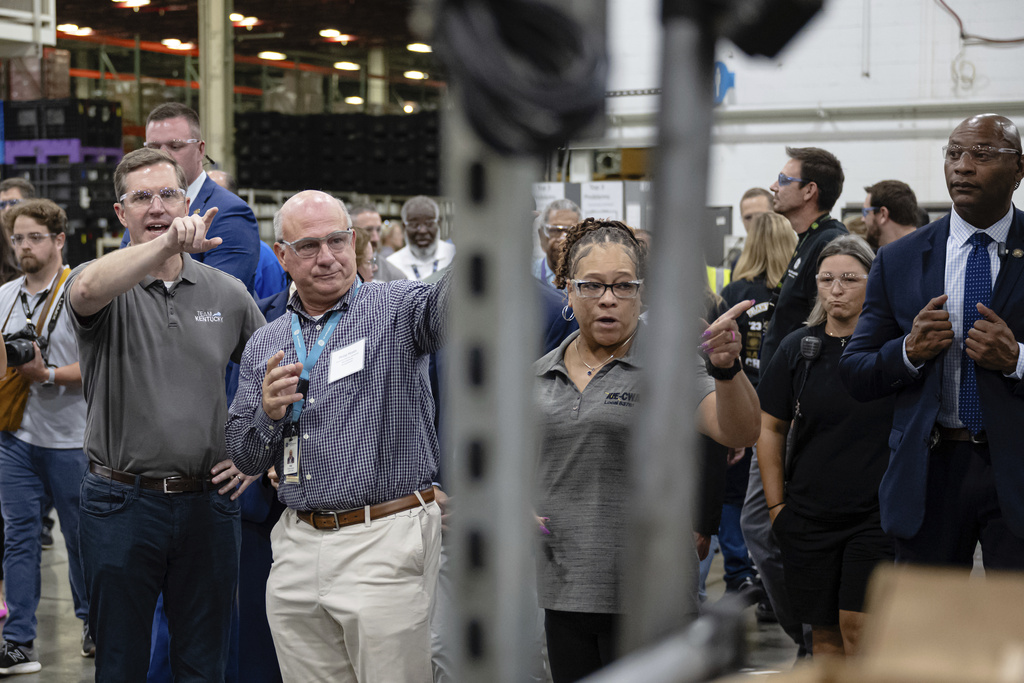 Kentucky Governor Andy Beshear tours work areas at GE Appliances global headquarters, Wednesday, Aug 13, 2025, in Louisville, Ky. (AP Photo/Jon Cherry)