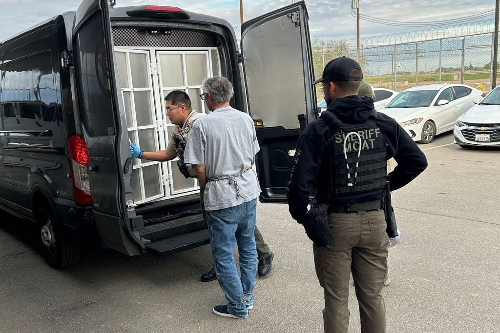 In this photo provided by the Navajo County Sheriff's Office, Michael Abatti, center, is transported from the Imperial County Jail in El Centro, Calif., on Dec. 30, 2025. (Navajo County Sheriff's Office via AP)