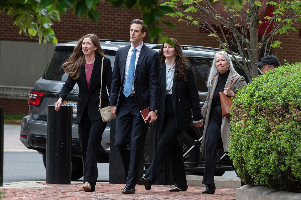 Patrice Failor, right, wife of former FBI Director James Comey, arrives, with family members, at the federal courthouse in Alexandria, Va., Wednesday, April 29, 2026. (AP Photo/Cliff Owen)