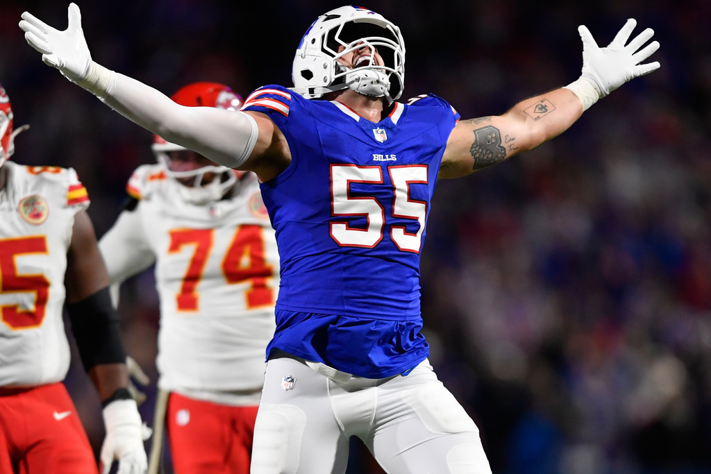 Buffalo Bills defensive end Michael Hoecht (55) celebrates after splitting a sack of Kansas City Chiefs quarterback Patrick Mahomes (15) with teammate Greg Rousseau during the second half of an NFL football game Sunday, Nov. 2, 2025, in Orchard Park. N.Y. (AP Photo/Adrian Kraus)
