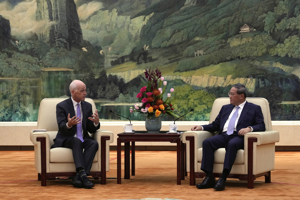 Rep. Adam Smith, D-Wash, left, speaks with Chinese Premier Li Qiang as he leads a bipartisan group of U.S. lawmakers for a meeting at the Great Hall of the People in Beijing, China, Sunday, Sept. 21, 2025. (AP Photo/Mahesh Kumar A., Pool)