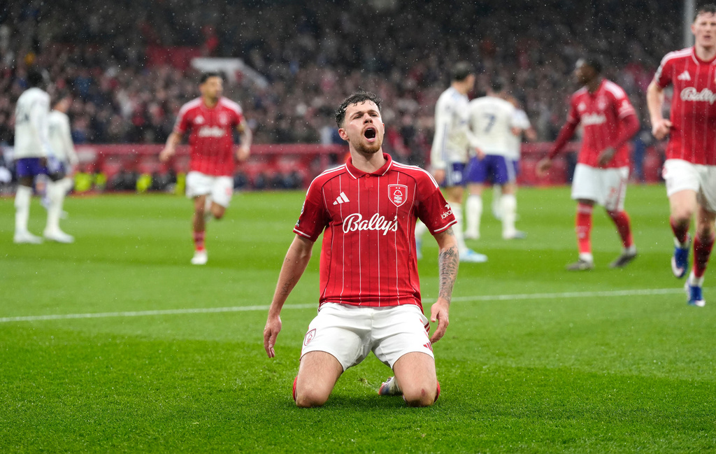 Nottingham Forest's Neco Williams celebrates scoring their side's first goal of the game during the Premier League soccer match between Nottingham Forest and Aston Villa, in Nottingham, England, Sunday April 12, 2026. (Nick Potts/PA via AP)