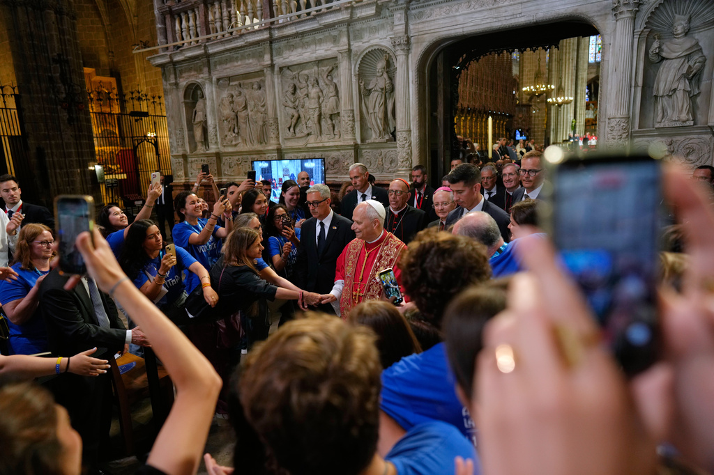 Pope Leo XIV greets people as he leaves after presiding over a midday prayer at the Cathedral of the Holy Cross and Saint Eulalia in Barcelona, Spain, Tuesday, June 9, 2026. (AP Photo/Bernat Armangue)