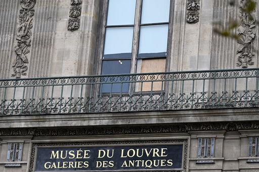 A plywood board covers the window where thieves entered the Louvre museum the day before to steal historic jewels, Monday, Oct. 20, 2025, in Paris. (AP Photo/Emma Da Silva) A plywood board covers the window where thieves entered the Louvre museum the day before to steal historic jewels, Monday, Oct. 20, 2025, in Paris. (AP Photo/Emma Da Silva)