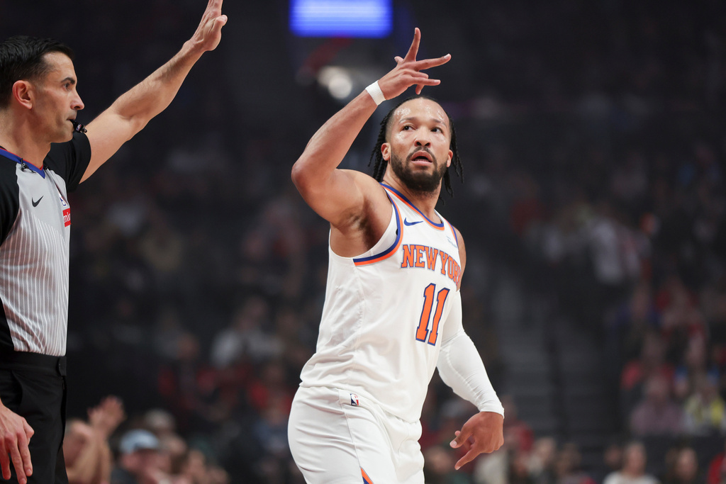 New York Knicks guard Jalen Brunson reacts after a basket against the Portland Trail Blazers during the first half of an NBA basketball game, Sunday, Jan. 11, 2026, in Portland, Ore. (AP Photo/Amanda Loman)