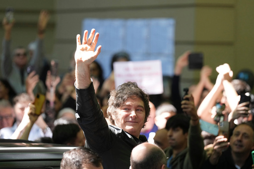 Argentina's President Javier Milei waves to supporters after voting during legislative midterm elections in Buenos Aires, Argentina, Sunday, Oct. 26, 2025. (AP Photo/Natacha Pisarenko) Argentina's President Javier Milei waves to supporters after voting during legislative midterm elections in Buenos Aires, Argentina, Sunday, Oct. 26, 2025. (AP Photo/Natacha Pisarenko)