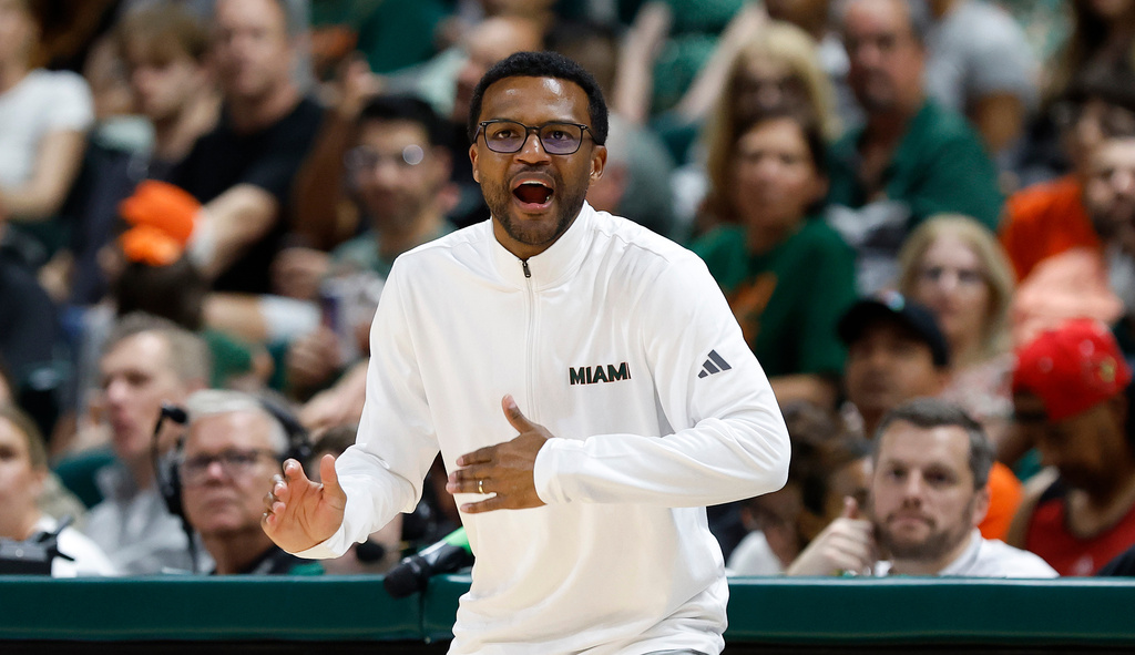 Miami head coach Jai Lucas reacts during the second half of an NCAA college basketball game against Louisville, Saturday, March 7, 2026, in Coral Gables, Fla. (AP Photo/Rhona Wise)
