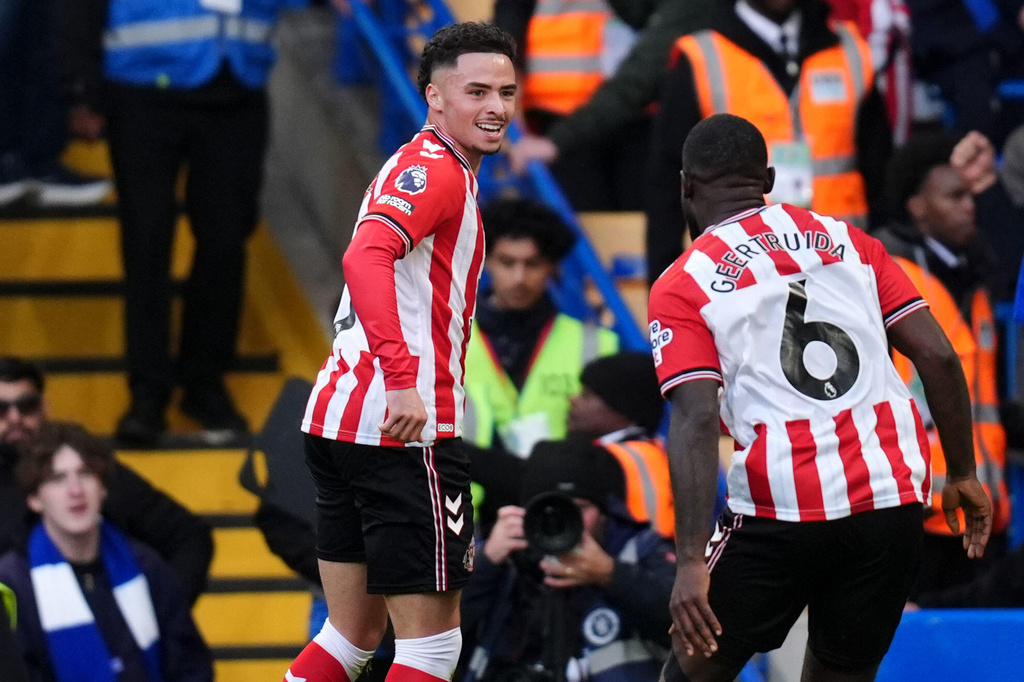 Sunderland's Chemsdine Talbi, left, celebrates scoring their side's second goal during the English Premier League soccer match between Chelsea and Sunderland at Stamford Bridge, London, Saturday Oct. 25, 2025. (John Walton/PA via AP)