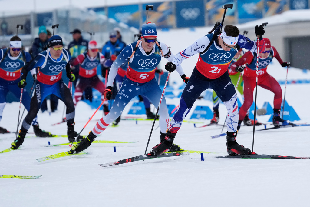 Fabien Claude, of France, right, and Sean Doherty, of the United States, in the men's 4x7.5-kilometer relay biathlon race at the 2026 Winter Olympics in Anterselva, Italy, Tuesday, Feb. 17, 2026. (AP Photo/Mosa'ab Elshamy)