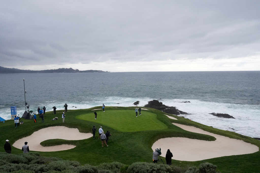 Rickie Fowler putts on the seventh hole at Pebble Beach Golf Links during the third round of the AT&T Pebble Beach Pro-Am golf tournament, Saturday, Feb. 14, 2026, in Pebble Beach, Calif. (AP Photo/Godofredo A. Vásquez)