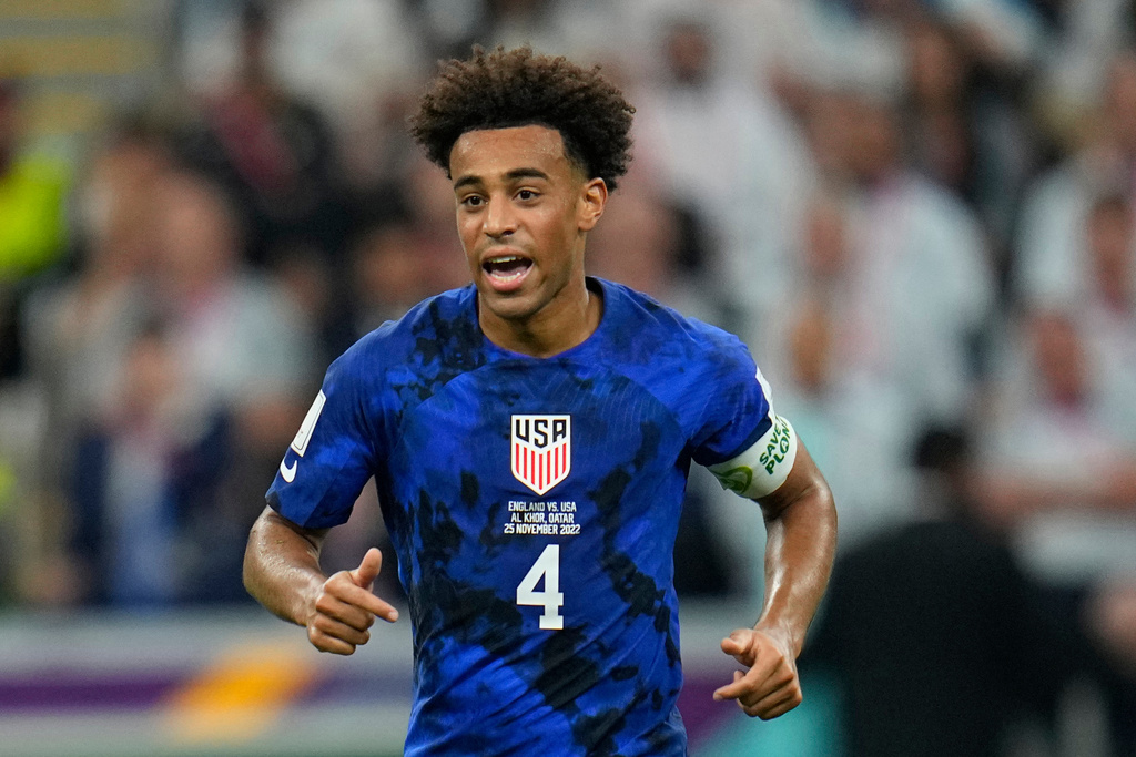 FILE - Tyler Adams of the United States runs on the pitch during the World Cup group B soccer match between England and The United States, at the Al Bayt Stadium in Al Khor, Qatar, on Nov. 25, 2022. (AP Photo/Julio Cortez, File)