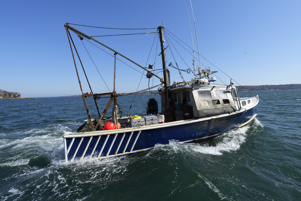 A scallop fishing boat leaves the dock, Tuesday, March 11, 2025, in Yarmouth, Maine. (AP Photo/Robert F. Bukaty)
