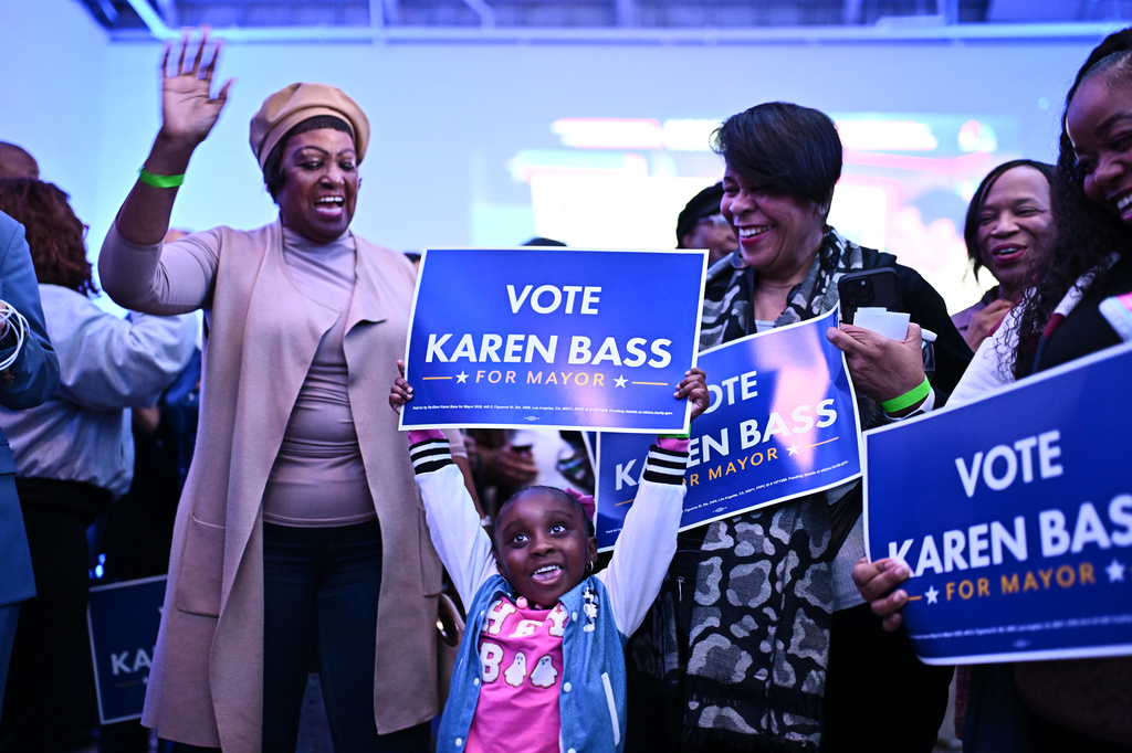 A young supporter holds a sign in support of Los Angeles Mayor Karen Bass during an election night event Tuesday, June 2, 2026, in Los Angeles. (AP Photo/William Liang)