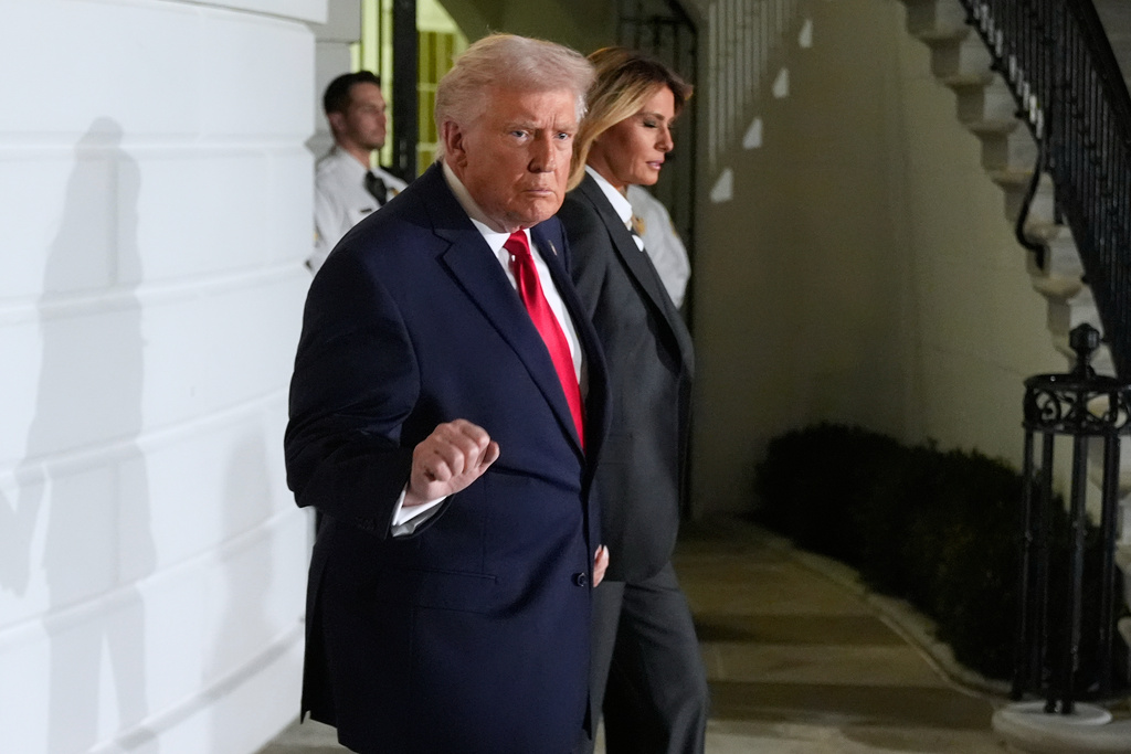 President Donald Trump and first lady Melania Trump, walk out of the White House, Tuesday, Feb. 24, 2026, to travel to the U.S. Capitol where he will deliver the State of the Union address to a joint session of Congress in the House chamber, in Washington. (AP Photo/Manuel Balce Ceneta)