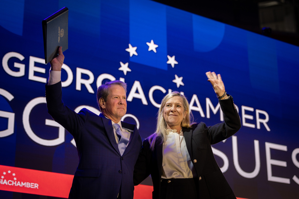 Gov. Brian Kemp and his wife Marty wave at the annual Georgia Chamber Eggs & Issues breakfast at Mercedes-Benz Stadium in Atlanta on Wednesday, Jan. 14, 2026. (Arvin Temkar/Atlanta Journal-Constitution via AP)