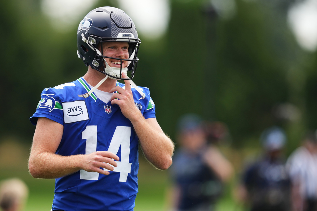 Seattle Seahawks quarterback Sam Darnold smiles during the NFL football team's training camp, Sunday, July 26, 2026, in Renton, Wash. (AP Photo/Lindsey Wasson)