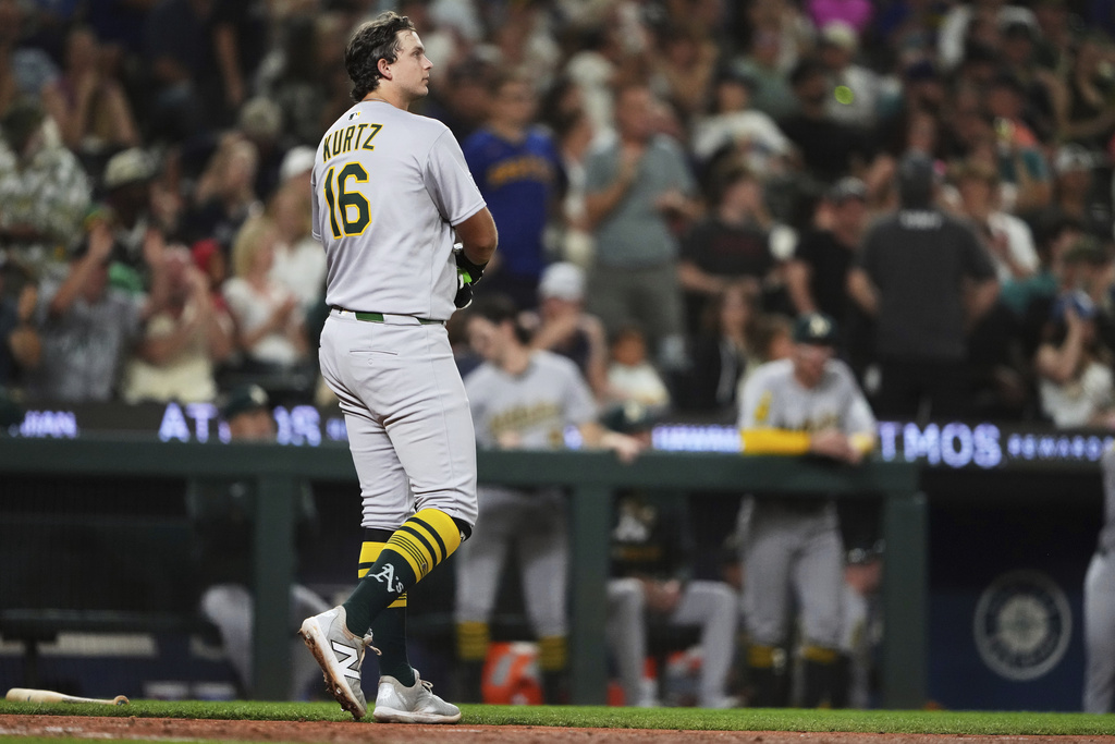 Athletics' Nick Kurtz (16) reacts to striking out to end the top of the eighth inning of a baseball game against the Seattle Mariners, Friday, Aug. 22, 2025, in Seattle. (AP Photo/Lindsey Wasson)