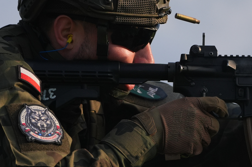 A Polish cadet shoots an M4 service rifle during the Sandhurst Military Skills Competition at the United States Military Academy in West Point, N.Y., Saturday, May 2, 2026. (AP Photo/Julia Demaree Nikhinson)