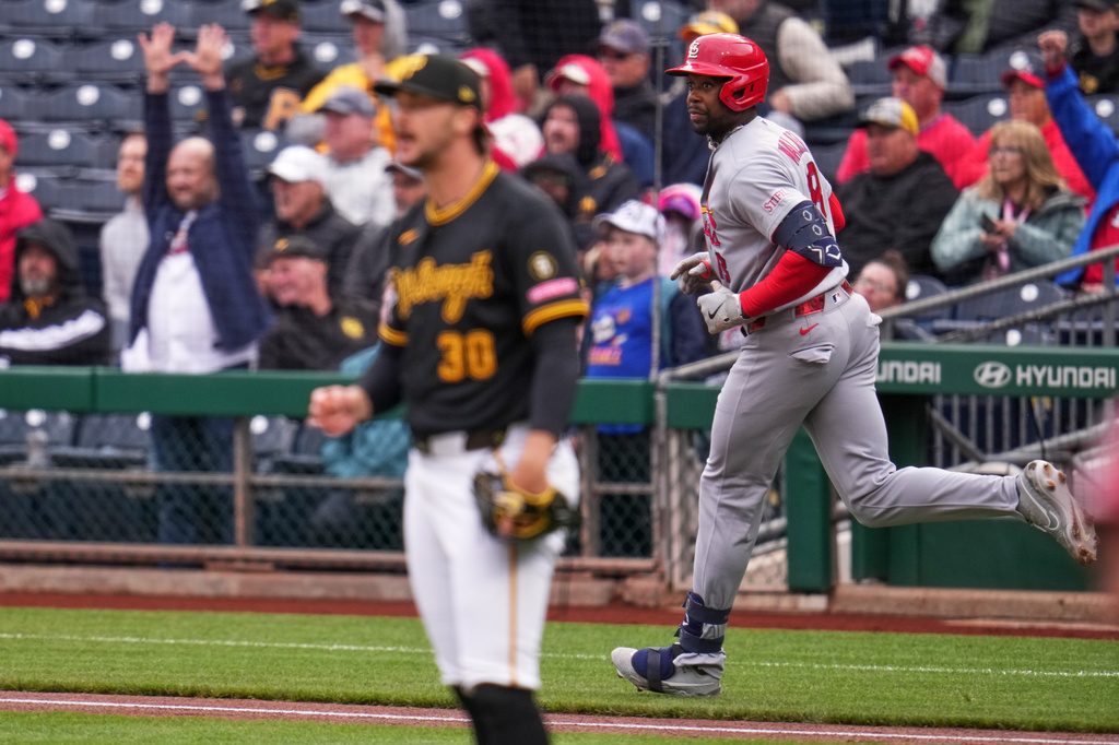St. Louis Cardinals' Jordan Walker, right, watches his two-run home run off Pittsburgh Pirates pitcher Paul Skenes (30) during the first inning of a baseball game in Pittsburgh, Thursday, April 30, 2026. (AP Photo/Gene J. Puskar)