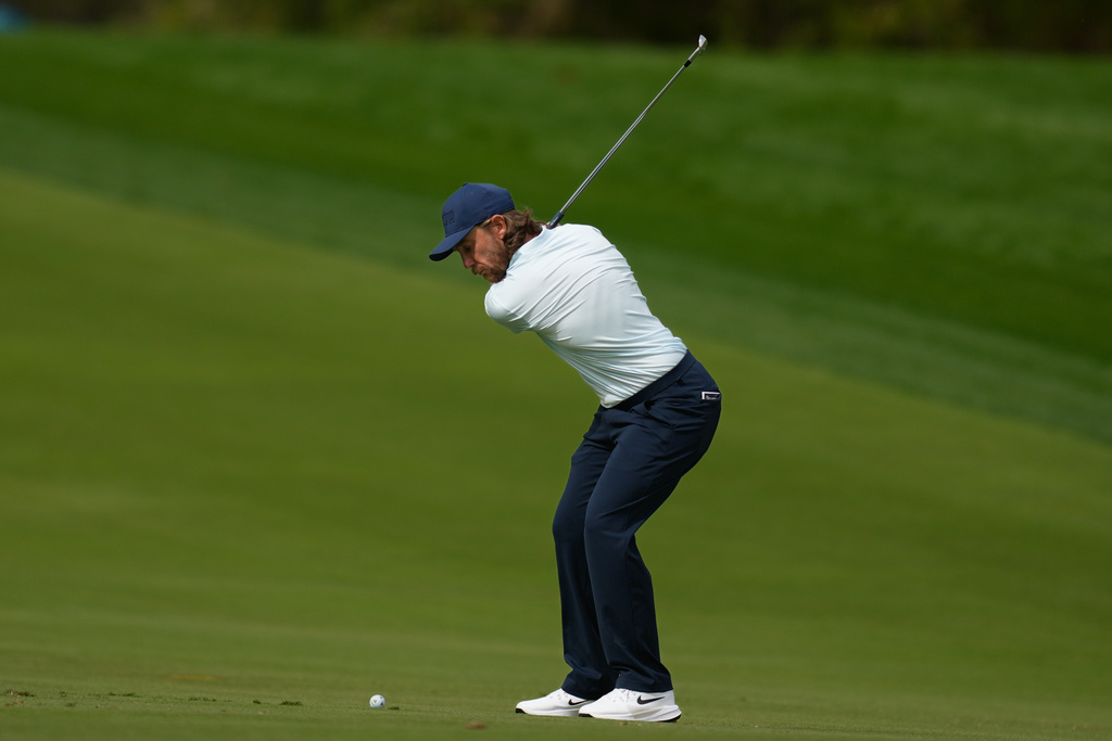 Tommy Fleetwood of England plays his second shot on the 3rd hole during second round of the Dubai Desert Classic in United Arab Emirates, Friday, Jan. 23, 2026. (AP Photo/Altaf Qadri)