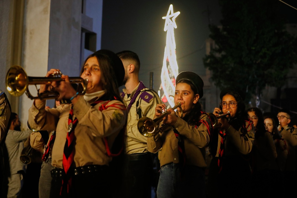 A Scout band plays during the lighting ceremony of a Christmas tree at the Greek Orthodox Mar Elias Church, months after the church was the site of a deadly suicide bombing, in the Dweila neighborhood of Damascus, Syria, Tuesday, Dec. 23, 2025. (AP Photo/Omar Sanadiki)