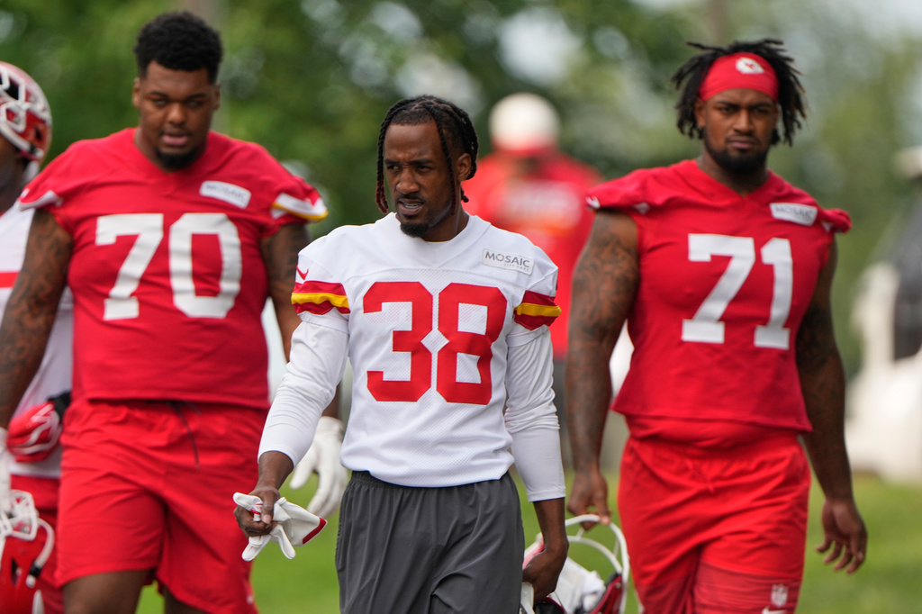 Kansas City Chiefs tackle Kahil Benson (70), cornerback L'Jarius Sneed (38) and tackle Josh Simmons (71) arrive at NFL football training camp Wednesday, July 29, 2026, in St. Joseph, Mo. (AP Photo/Charlie Riedel)