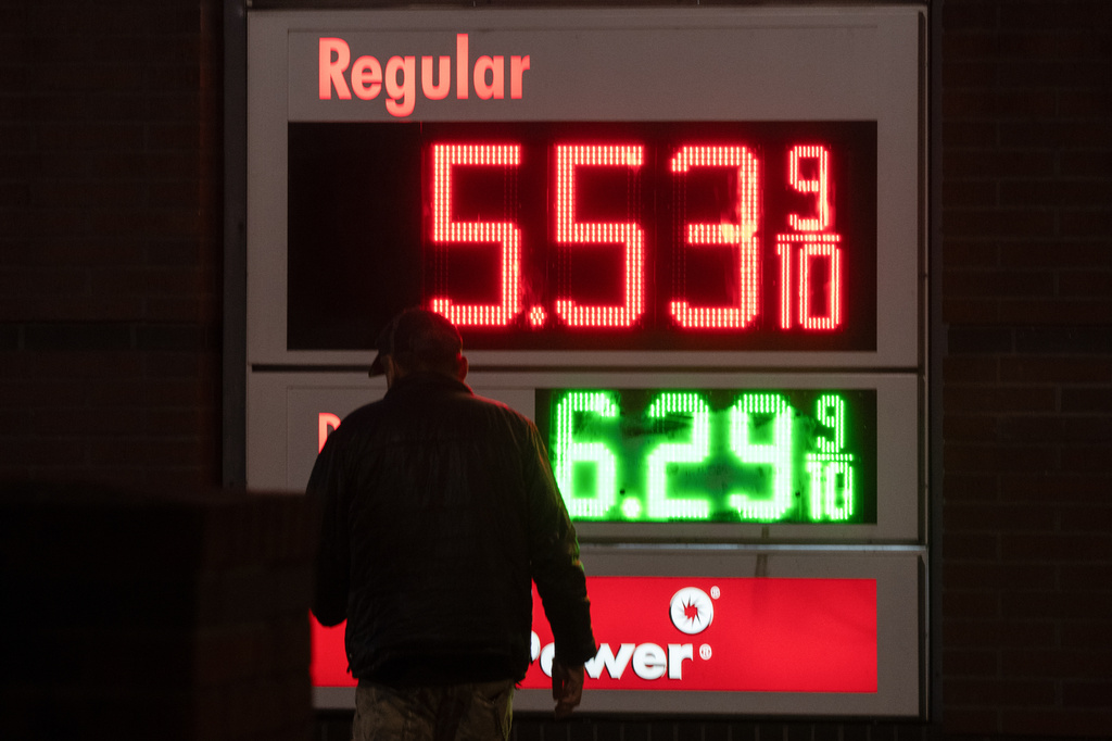 A person walks past a sign for fuel prices at a gas station on Wednesday, May 6, 2026, in Portland, Ore. (AP Photo/Jenny Kane)