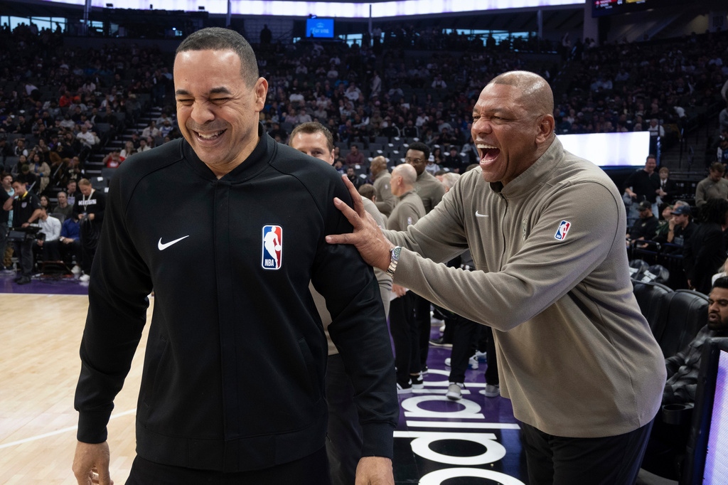 FILE - Milwaukee Bucks head coach Doc Rivers, right, laughs with referee Curtis Blair before an NBA basketball game against the Sacramento Kings in Sacramento, Calif., March 12, 2024. (AP Photo/José Luis Villegas, File)