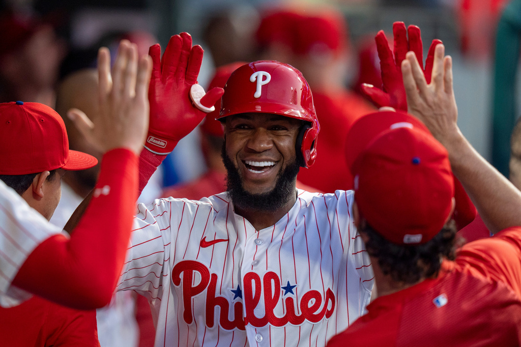 Philadelphia Phillies' Bryan De La Cruz celebrates his home run with teammates during the fifth inning of a baseball game against the Los Angeles Dodgers, Wednesday, July 22, 2026, in Philadelphia. (AP Photo/Chris Szagola)