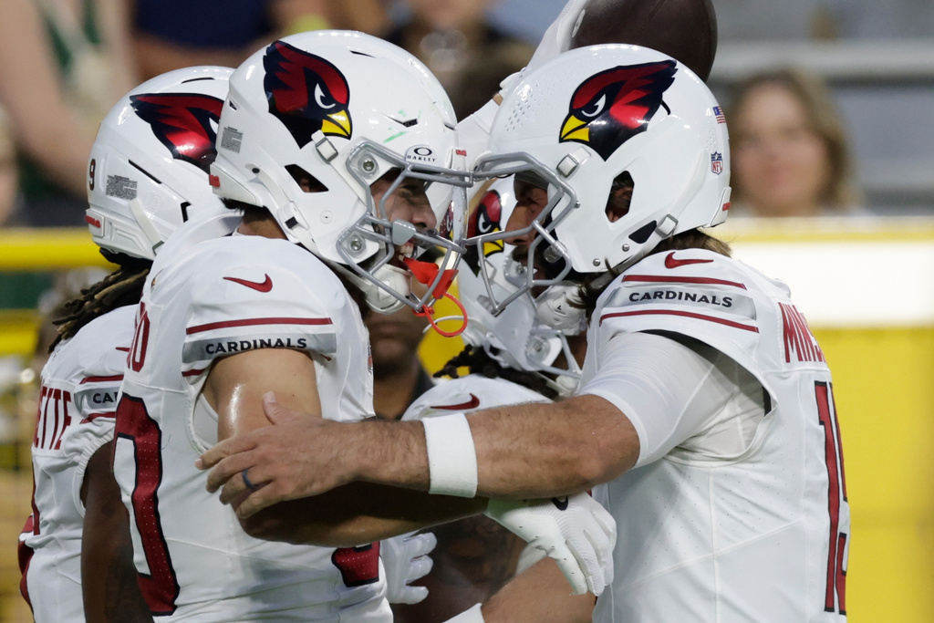 Arizona Cardinals' Simi Fehoko celebrates his touchdown catch with Gardner Minshew II during the first half of a preseason NFL football game against the Green Bay Packers Friday, Aug. 28, 2026, in Green Bay, Wis. (AP Photo/Matt Ludtke)