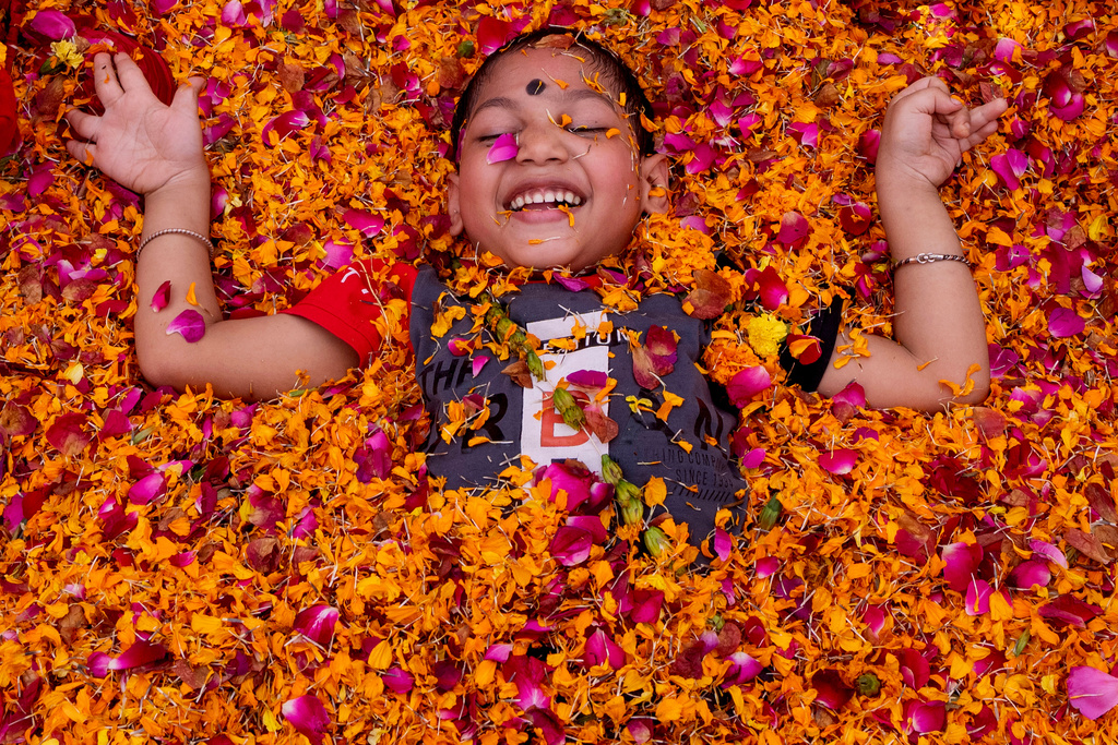 A child with cerebral palsy attends Holi, the Hindu festival of colors, at an event organized by the Trishla Foundation in Prayagraj, India,Sunday, March 1, 2026. (AP Photo/Rajesh Kumar Singh)
