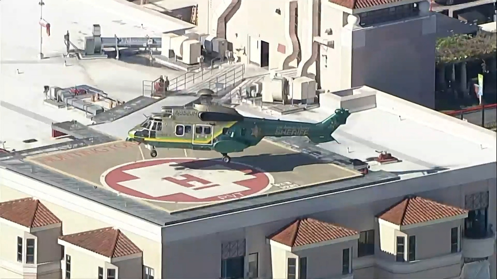 A police helicopter lands on helipad on Monday, Dec. 29, 2025 in San Bernardino, Calif. (ABC7 Los Angeles via AP)