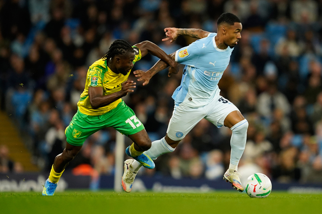 Norwich City's Benjamin Chrisene holds Manchester City's Allan Elias during the third-round English League Cup soccer match between Manchester City and Norwich City in Manchester, England, Thursday, Sept. 17, 2026. (AP Photo/Dave Thompson