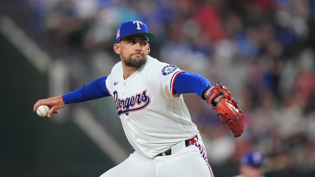 Texas Rangers starting pitcher Nathan Eovaldi throws during the first inning of a baseball game against the Seattle Mariners, Saturday, July 25, 2026, in Arlington, Texas. (AP Photo/LM Otero)