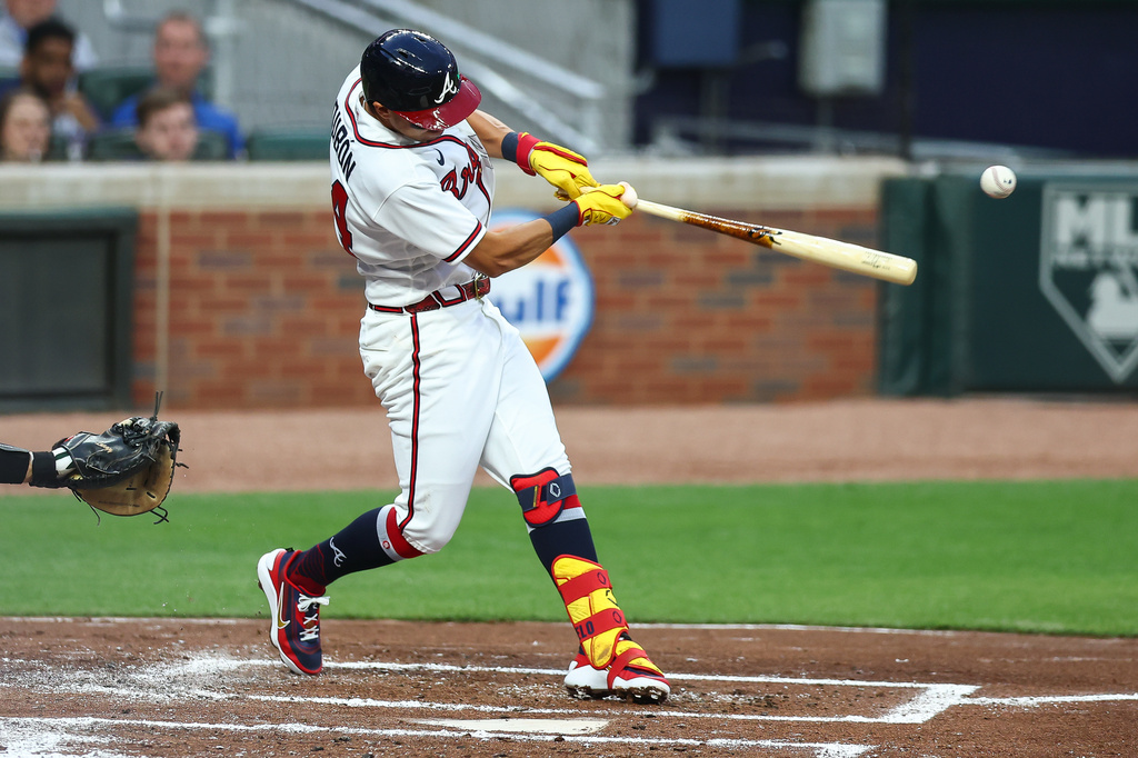 Atlanta Braves' Mauricio Dubón hits a two-RBI single in the first inning of a baseball game against the Athletics, Monday, March 30, 2026, in Atlanta. (AP Photo/Colin Hubbard)