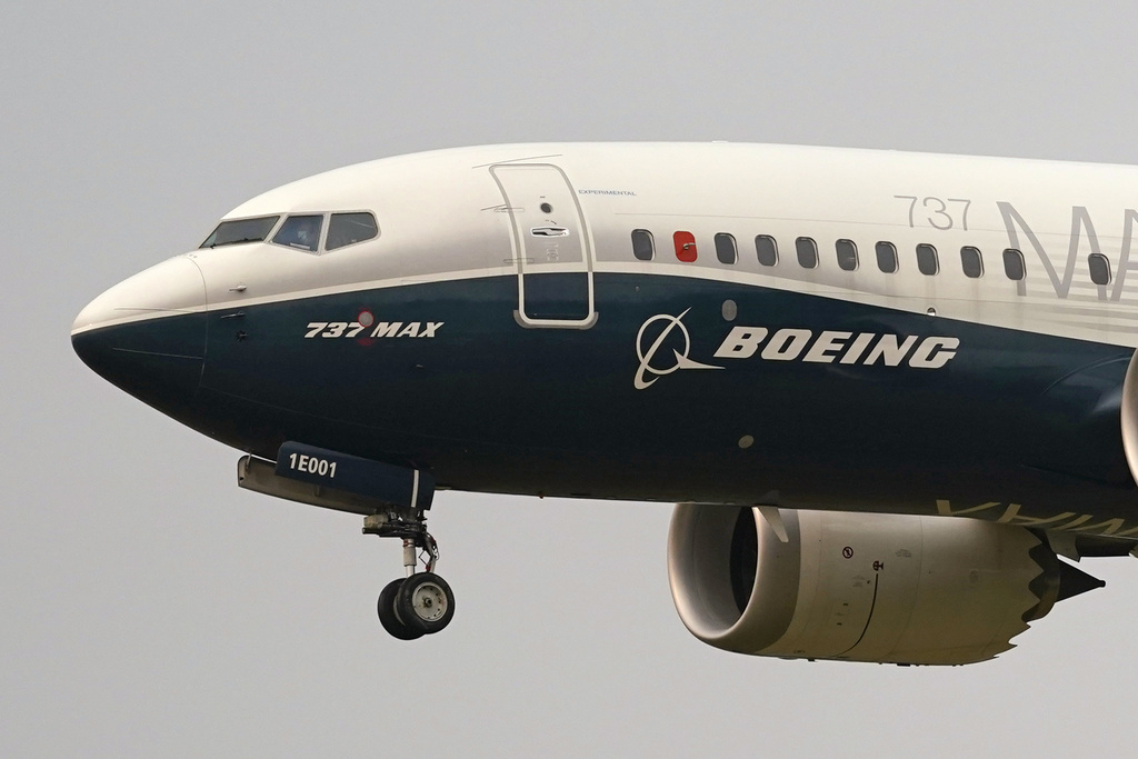 FILE - A Boeing 737 Max jet prepares to land at Boeing Field following a test flight in Seattle, Sept. 30, 2020. (AP Photo/Elaine Thompson, File)