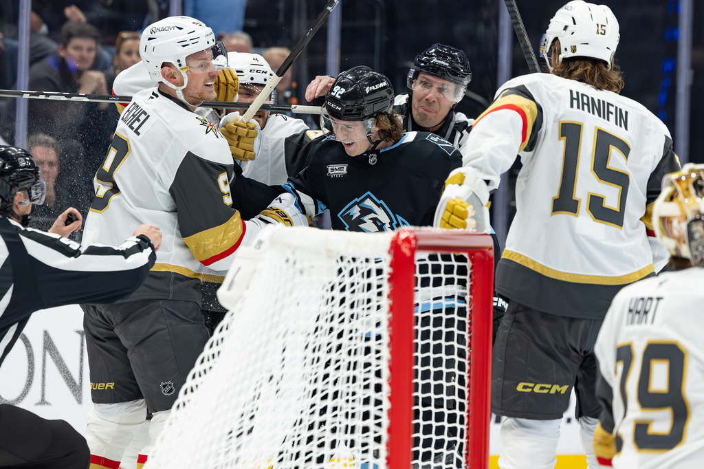 Utah Mammoth center Logan Cooley (92) fights with Vegas Golden Knights center Jack Eichel (9) during the first period of Game 3 of the first round in an NHL hockey Stanley Cup playoff series, Friday, April 24, 2026, in Salt Lake City. (AP Photo/Melissa Majchrzak)