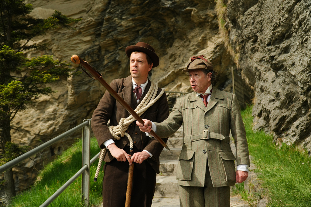 Martin Iggland, left, as Melchior Anderegg and Philip Porter, as, Sherlock Holmes during an event recreating the fateful confrontation between Sherlock Holmes and Professor Moriarty by the members of the Sherlock Holmes Society of London, at the Reichenbach Falls, Switzerland, May 3, 2026. (AP Photo/Niccolo Lupone, Pool)