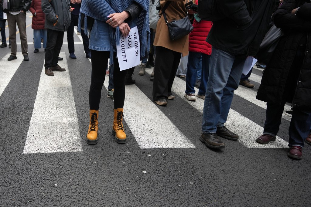 Serbian journalists block the traffic outside the offices of Serbia's President Aleksandar Vucic in Belgrade, Serbia, Wednesday, April 1, 2026, in protest of mounting attacks and pressure on the media. (AP Photo/Darko Vojinovic)