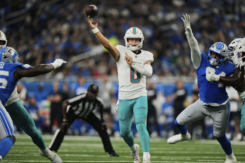 Miami Dolphins quarterback Zach Wilson (0) passes during the first half of an NFL preseason football game against the Detroit Lions Saturday, Aug. 16, 2025, in Detroit. (AP Photo/Ryan Sun)