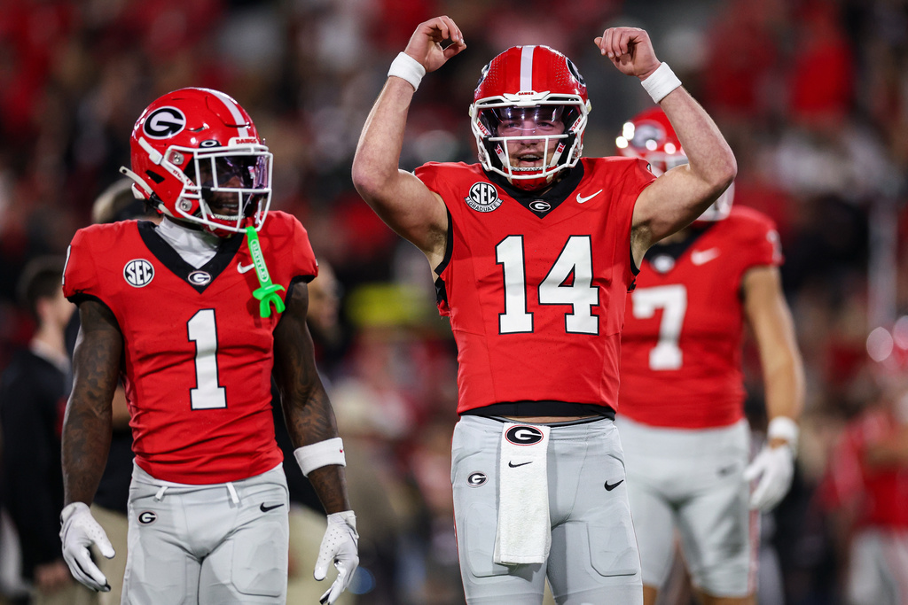 Georgia quarterback Gunner Stockton (14) reacts during pregame warmups before the start of an NCAA college football game against Texas, Saturday, Nov. 15, 2025, in Athens, Ga. (AP Photo/Colin Hubbard)