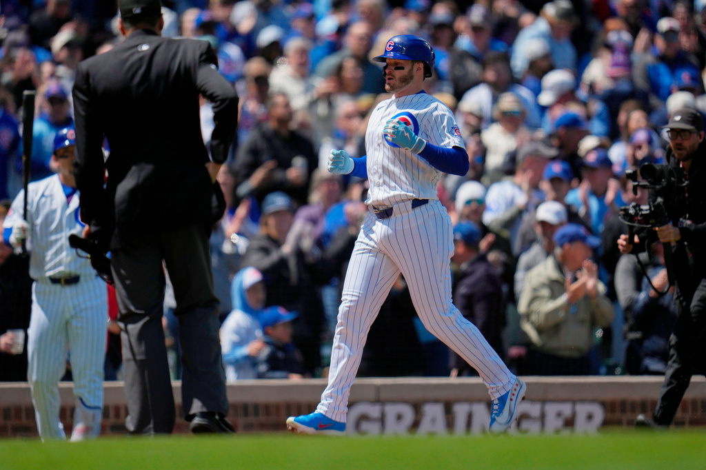 Chicago Cubs' Ian Happ (8) trots home after hitting a home run during the second inning of a baseball game against the Arizona Diamondbacks, Saturday, May 2, 2026, in Chicago. (AP Photo/Erin Hooley)