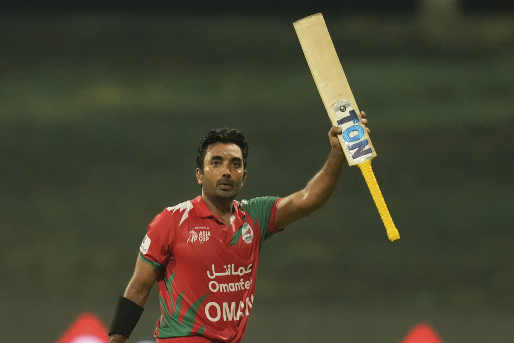 Oman's Aamir Kaleem acknowledge the fans as he walks off the field after losing his wicket during the Asia Cup cricket match between India and Oman at Zayed Cricket Stadium in Abu Dhabi, United Arab Emirates, Friday, Sept. 19, 2025. (AP Photo/Altaf Qadri)